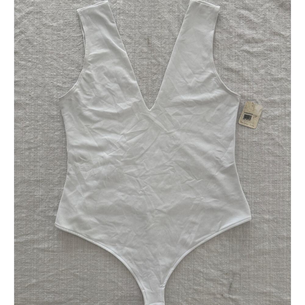 Free People NWT *with discoloration | Keep It Sleek white bodysuit | size Large